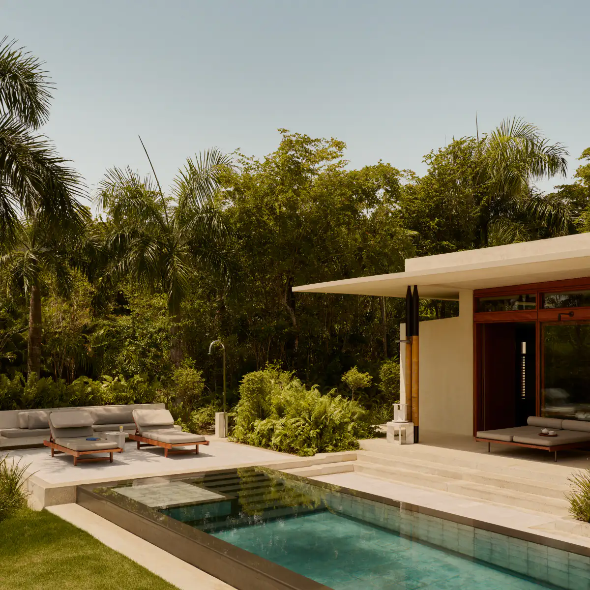 A villa terrace opening onto dense forest